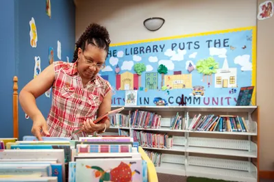 Librarian Theresa Tyree sorts books in the Prescott/Nevada County Library in Prescott, Ark. on Sept. 6, 2023. Photo by Rory Doyle.